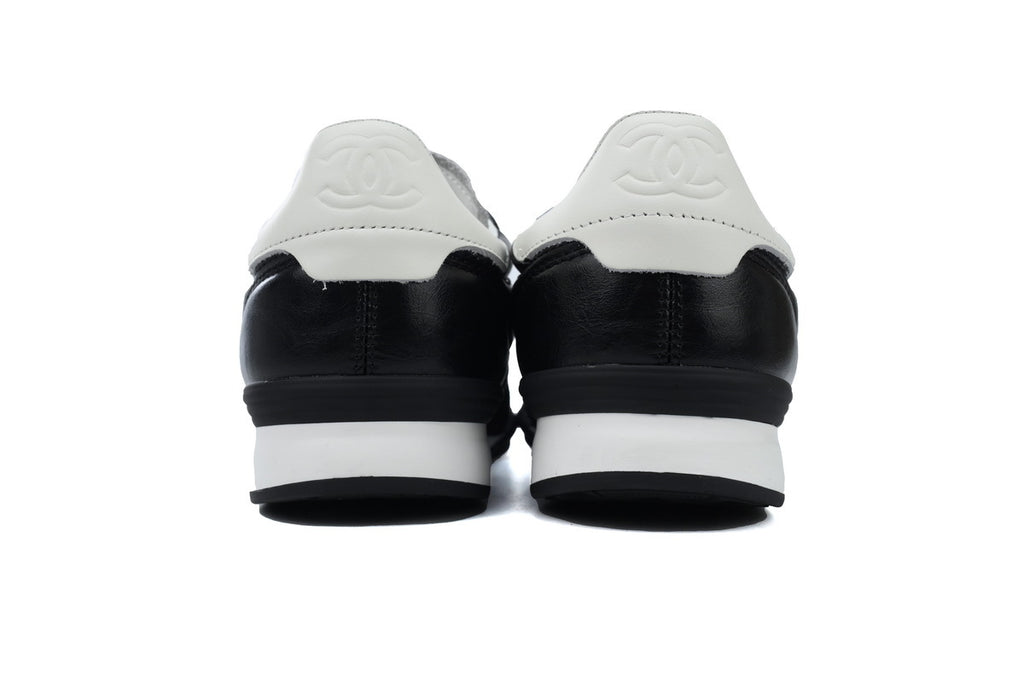 Chanel Black Quilted Suede Low-Top Sneakers