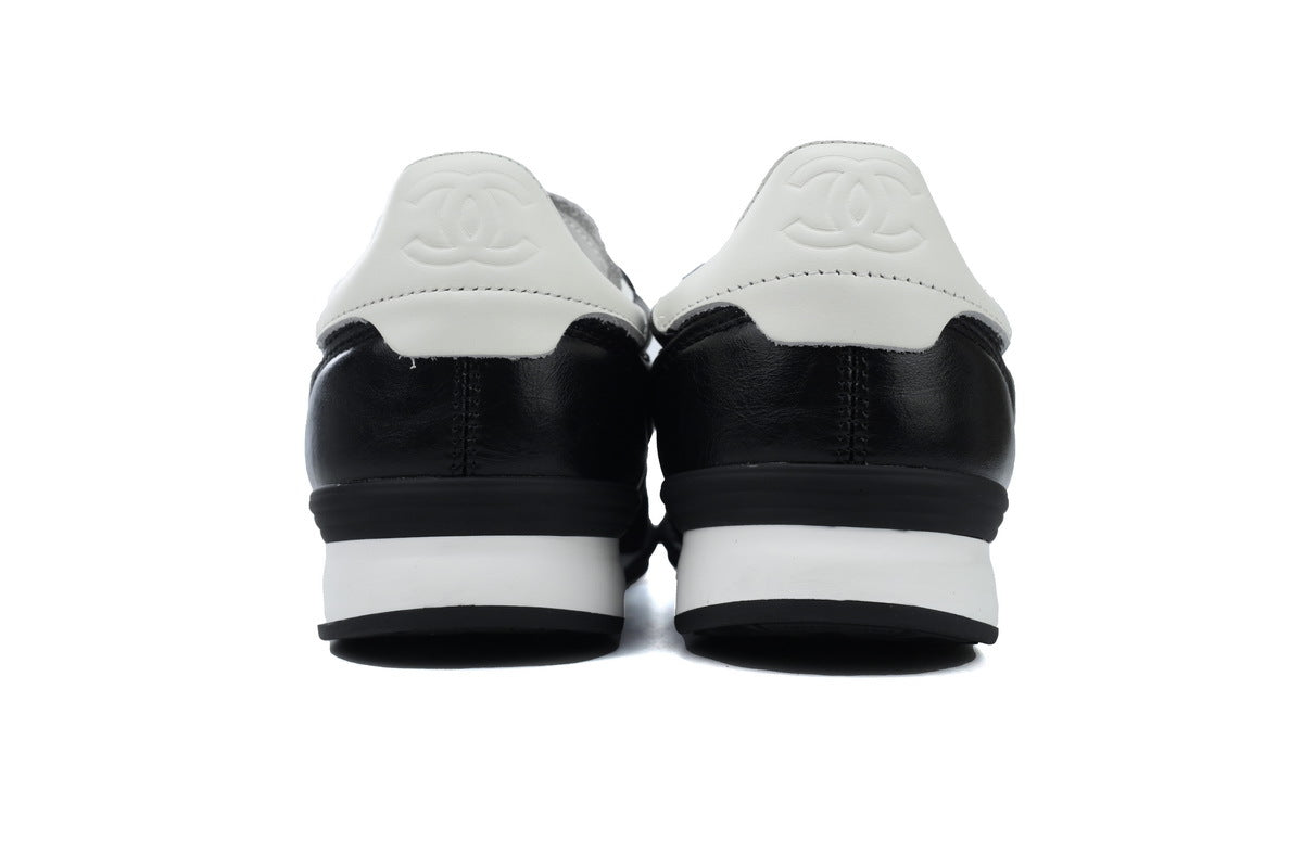 Chanel Black Quilted Suede Low-Top Sneakers