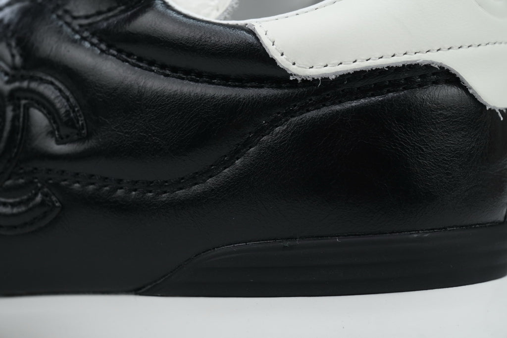Chanel Black Quilted Suede Low-Top Sneakers