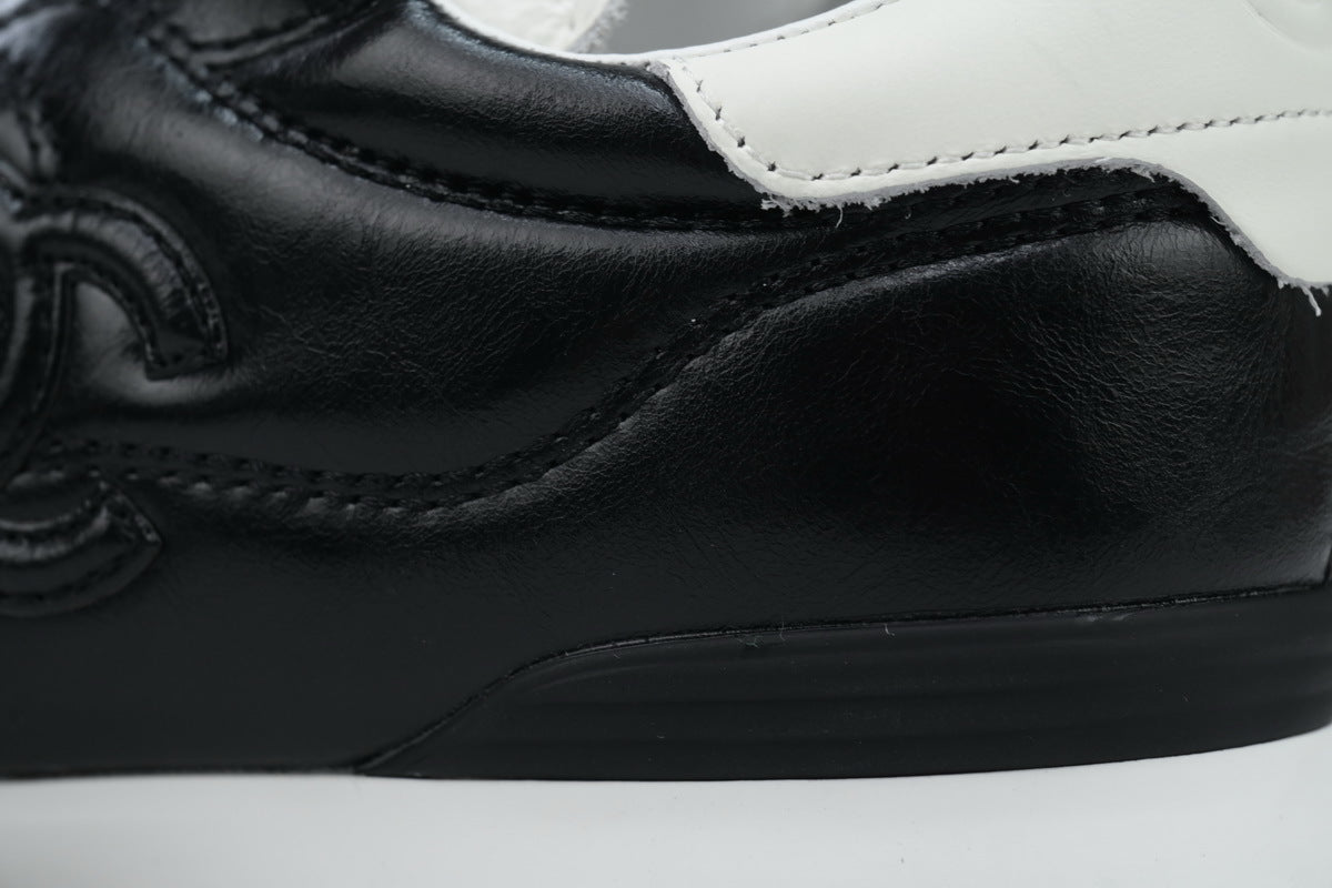 Chanel Black Quilted Suede Low-Top Sneakers